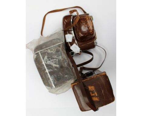 Vintage Yashica-Mat with unused case and a Kodak retina reflex III