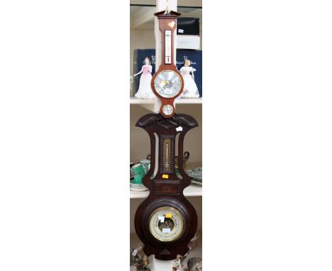 An oak wheel barometer with a contemporary wheel barometer (2)