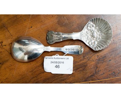 A Victorian silver fiddle pattern caddy spoon, Elizabeth Eaton, London 1850, together with a George III silver Kings pattern 