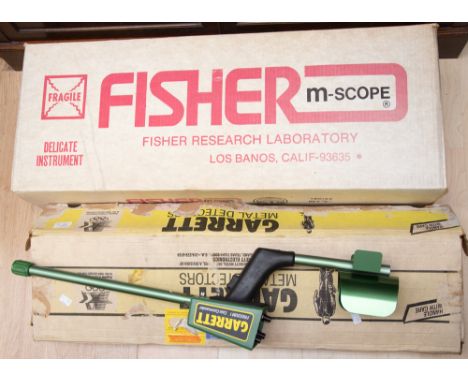 A boxed and cased Fisher m-scope metal detector along with another metal detector (2) 
