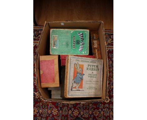 A large collection of vintage jigsaws, some complete. (4 boxes)
