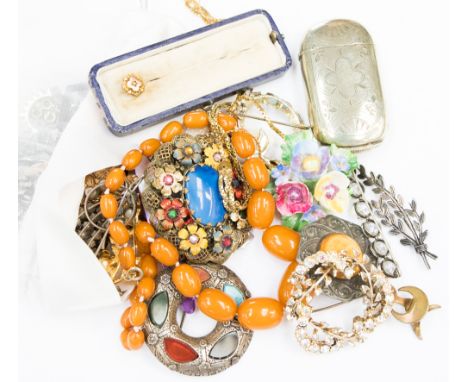 A small quantity of costume jewellery including, amber style beads, celtic style brooch set with agates, 1950s brooches, stic