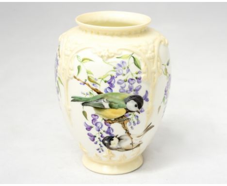 A Royal Worcester vase, relief moulded arcading, hand painted by Florence Harvey and dated 1954, with great tits on wisteria 