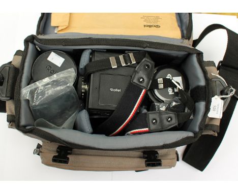 A vintage Rolleiflex 6002 camera including two including two lenses and accessories 