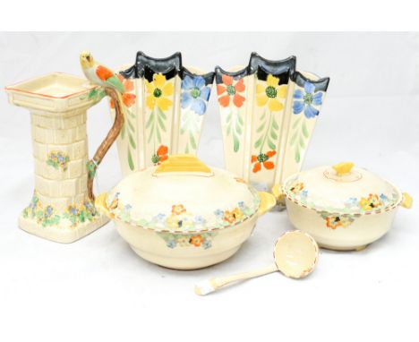 A pair of Art Deco wall pockets by Arthur Wood, a Wade Heath jug, two Crown Devon dishes with lids and a serving ladle (8)