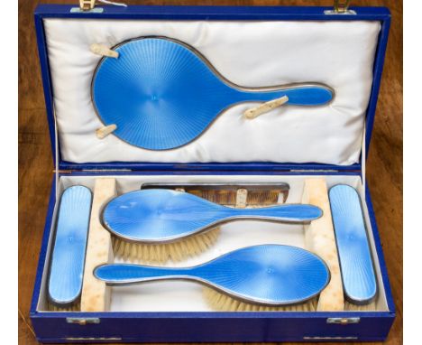 A cased silver and engine turned blue enamelled dressing table set, London,1946  Art Deco maker Padgett & Bramham Ltd (comb d