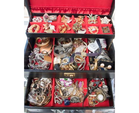 A jewellery box containing a good quantity of costume jewellery and watches to include stone set brooches, necklaces and brac