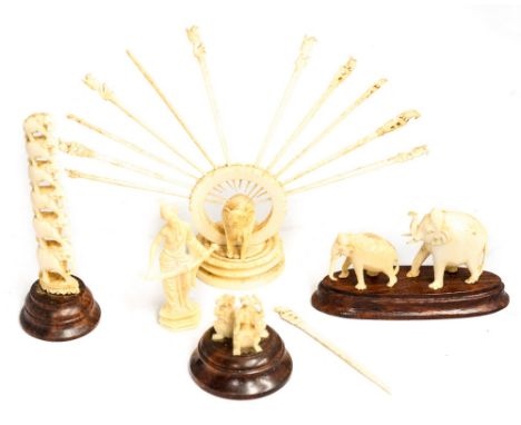 Antique ivory to include a cocktail stick stand and ornaments