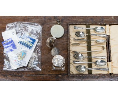 A white metal bullet/shell shaped inkwell, a silver capped perfume bottle, a 1902 light meter, walking cane mounts, badges et