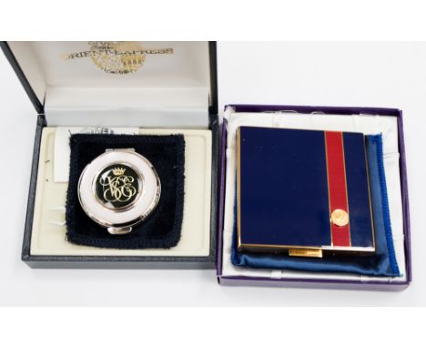 A boxed white metal 'Orient Express' pill box together with a square enamelled 'Wimbledon' compact