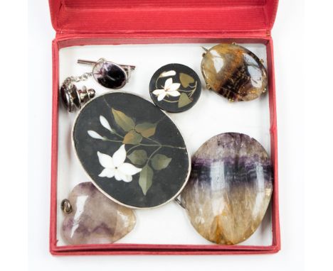  A collection of Ashford marble and Derbyshire Blue John to include brooches, tie pin, clip back earrings etc