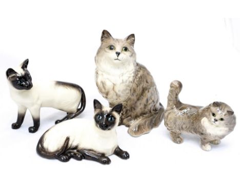 Four Beswick cats