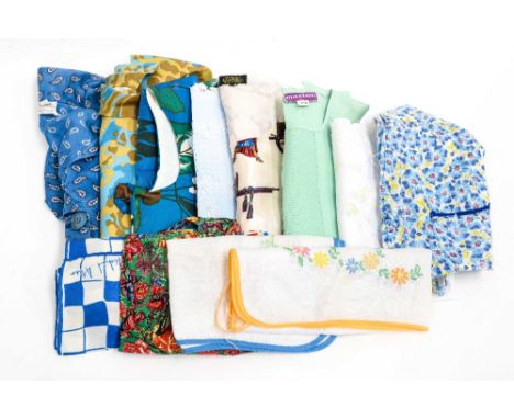 A collection of 1950s aprons, a blue silk scarf, to include a floral,an embroidered and two children's aprons, together with 