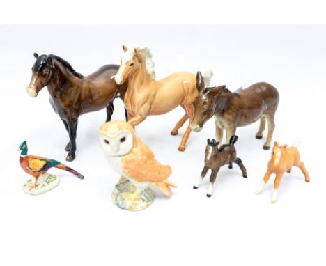 A collection of Beswick figures, including horses, foals, donkey , pheasant and owl (7)