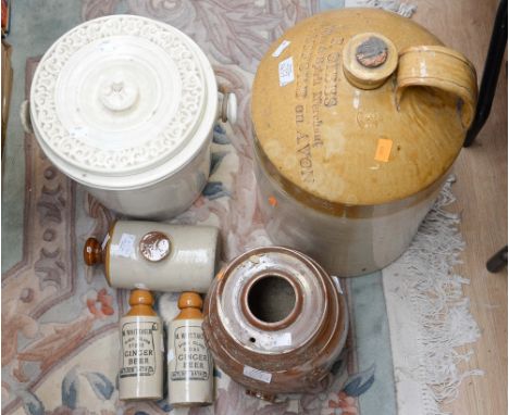 A large stoneware flagon inscribed 'R Gibbs, wine and spirit merchant, Stratford on Avon', together with two Whittaker ginger