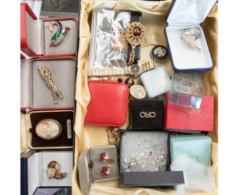 A box containing an assortment of vintage costume jewellery