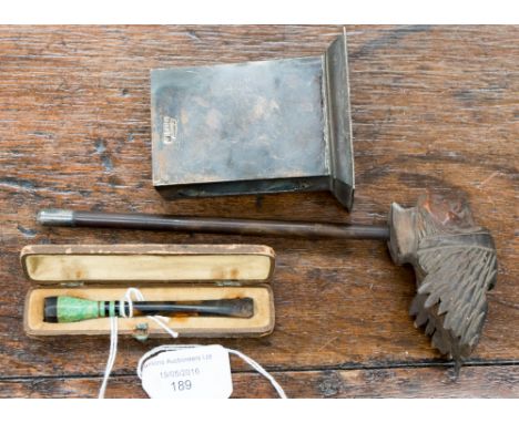 A carved American Indian pipe bowl with silver band Birmingham, a cased ladies' 1930 cheroot/cigarette holder with mottled pl