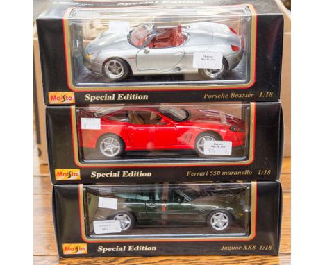 Three Maristo boxed model cars, to the 1.18 scale comprising Porsche, Boxster, Ferrari 550 Maranello and a Jaguar XK8 all spe