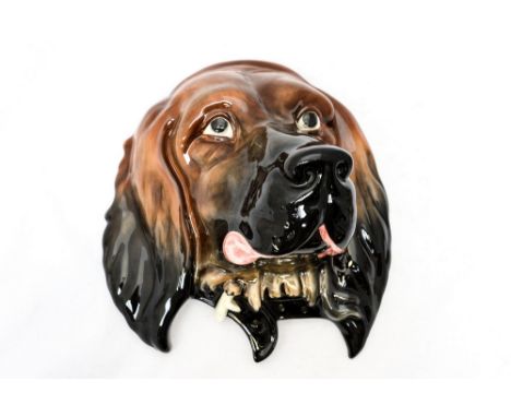 A Beswick dog plaque, model no 668 impressed to back 