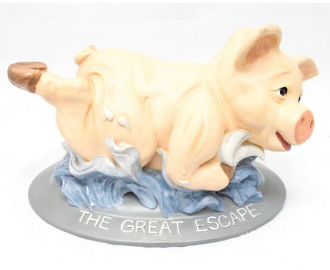 An oak framed lozenge shaped mirror together with a large boxed ceramic pig (2) 