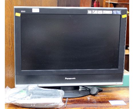 A Panasonic Viera flatscreen TV, complete with remote controls and manual