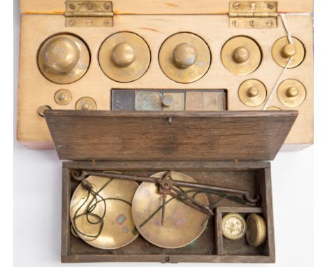 A boxed set of weighing scales, with a cased set of Apothecary scales(2)