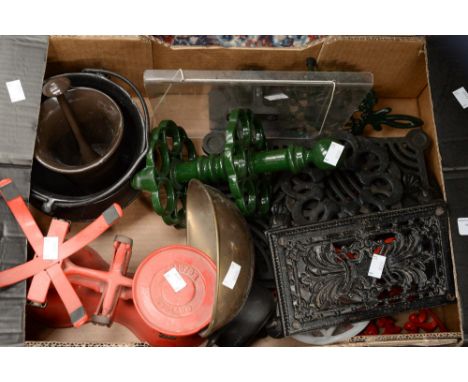 A good box of cast iron kitchenalia, including weighing scales, cookery book, book stands, trivets etc