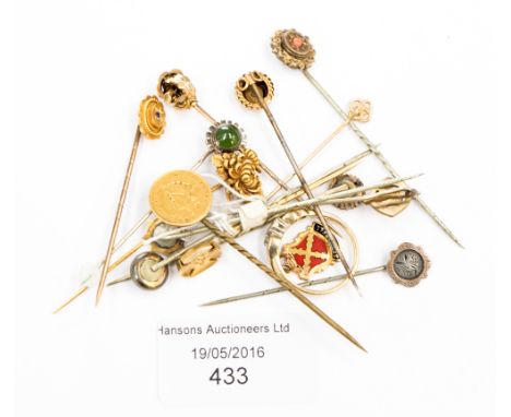 Stick pins with yellow metal tops a 9 carat charm, and a 9 carat gold ring 