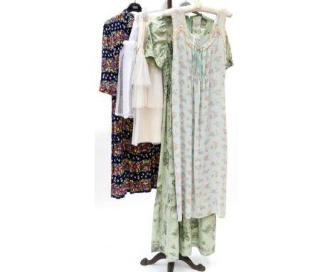 A good silk floral patterned navy 1950s dress with a floral pattern design (zip replaced) with a pale green 1970s maxi dress,