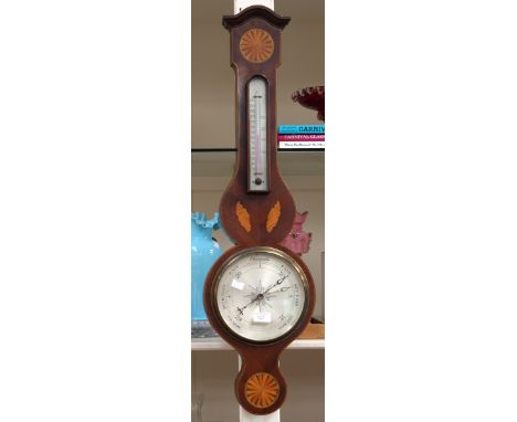 An Edwardian banjo barometer with satinwood and harewood inlay, shell and star motifs