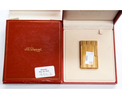 A Dupont boxed yellow metal cigarette lighter