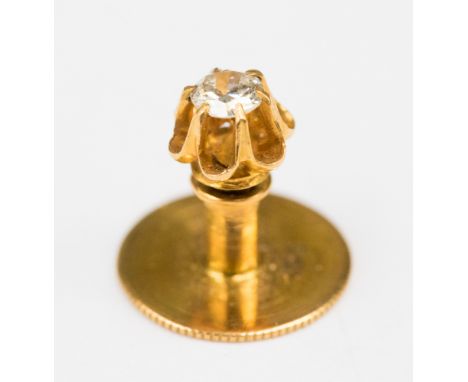 A diamond tie stud set in 15ct gold in a box