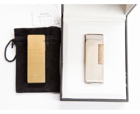 A silver plated Dunhill lighter with engine turned cased, in original box with flints, together with a gilt metal Dunhill lig