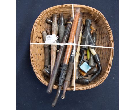 A collection of pipe stems with horn, amber and metal parts
