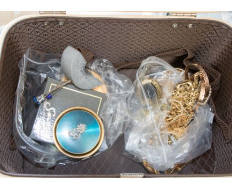 A bag of assorted costume jewellery, including rolled gold bracelets, a double string of faux pearls, a single string of faux