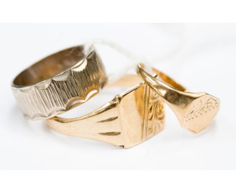 Two 9ct gold signet rings together with a 9ct white gold ladder patterned wedding band 