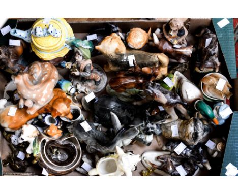 A box containing a collection of items including a range of animals horses, dogs, birds, deer, sheep, rabbits, brass items, n