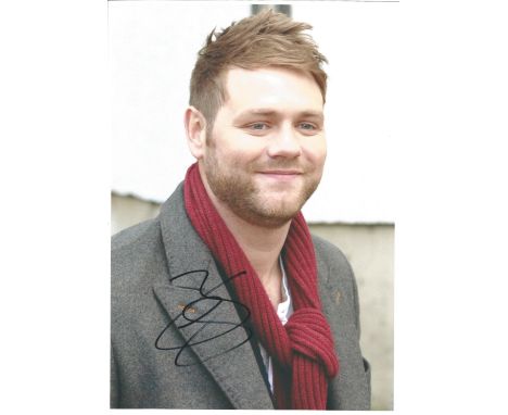Singer Brian McFadden signed 12x8 colour photo in excellent condition. Brian Nicholas McFadden is an Irish singer, songwriter