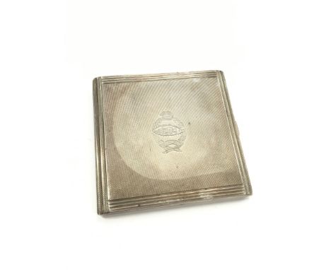 A WWII engine turned silver cigarette case with Regimental emblem decoration of the Royal Tank Regiment; Fear Naught (140g).