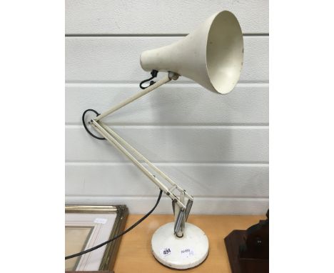 A white painted angle poise table lamp.