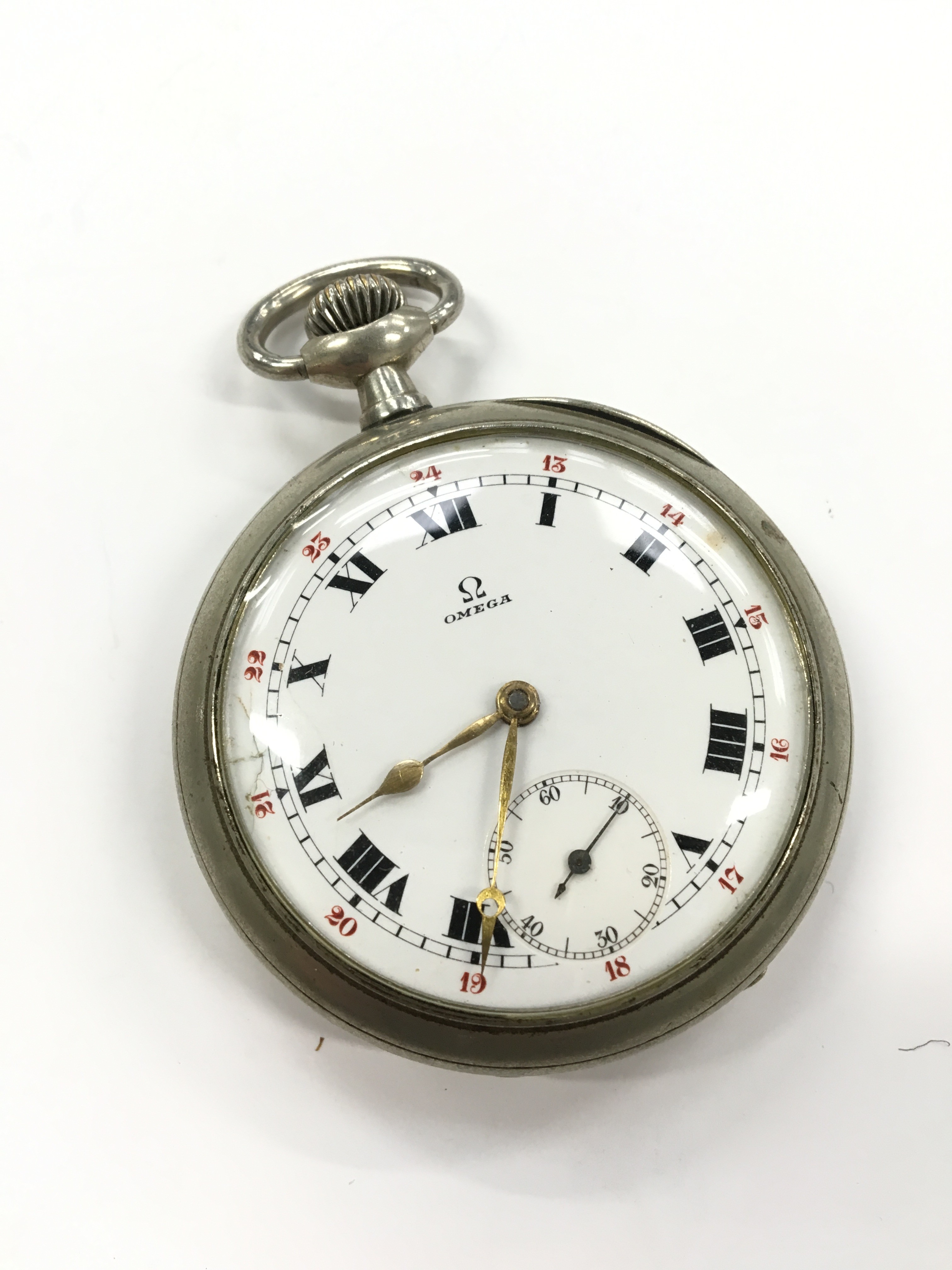 A metal Omega pocket watch with white dial and Roman Numerals, seconds ...