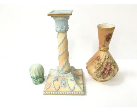 A Royal Worcester cream and blue ground candlestick decorated with rams horns, floral swags and gilded decoration, reg no 170