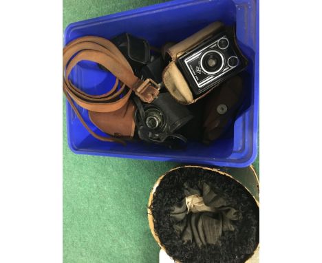 A late Victorian Marmot muff in case and a quantity of cameras, camera equipment, belts etc.