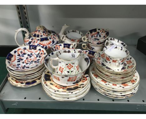 The residue of an early 20th century china tea service decorated in the Gwen Imari pattern by W A A and Co..
