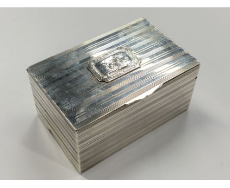 A French silver cigarette box with integral gilded vesta by Bointaburl, Paris, the lid decorated with a small panel depicting