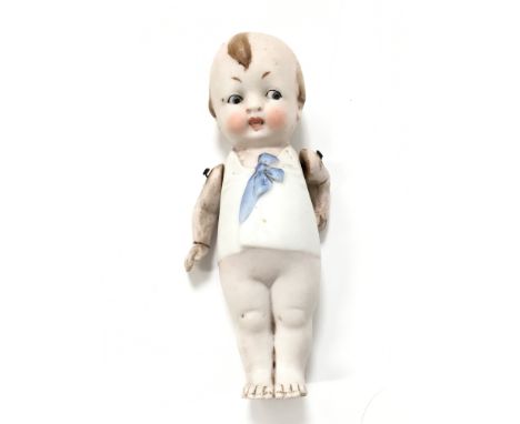 An early 20th century Kewpie bisque china doll with articulated arms.