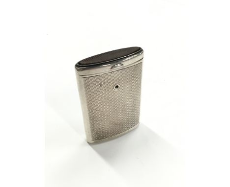 An engine turned silver Vesta case by Walker & Hall with sliding action.