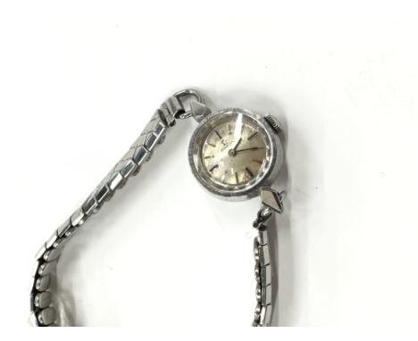 A ladies Omega manual wind wristwatch fitted in a stainless steel Omega case, Omega crown on an expandable strap.