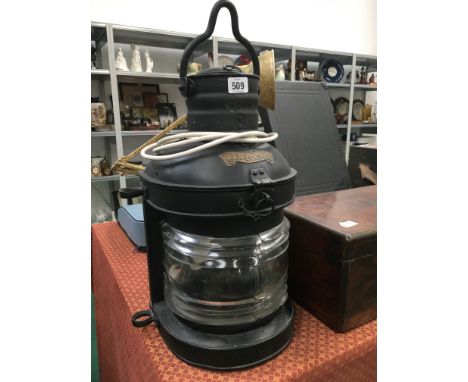 A large black painted mast head metal ship's light.