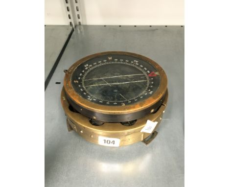 A brass cased ship's compass (no fluid).
